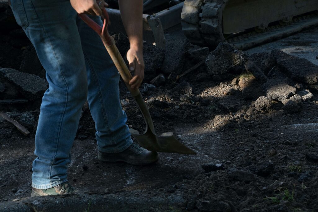 a man collecting stones for building his patio and water features 